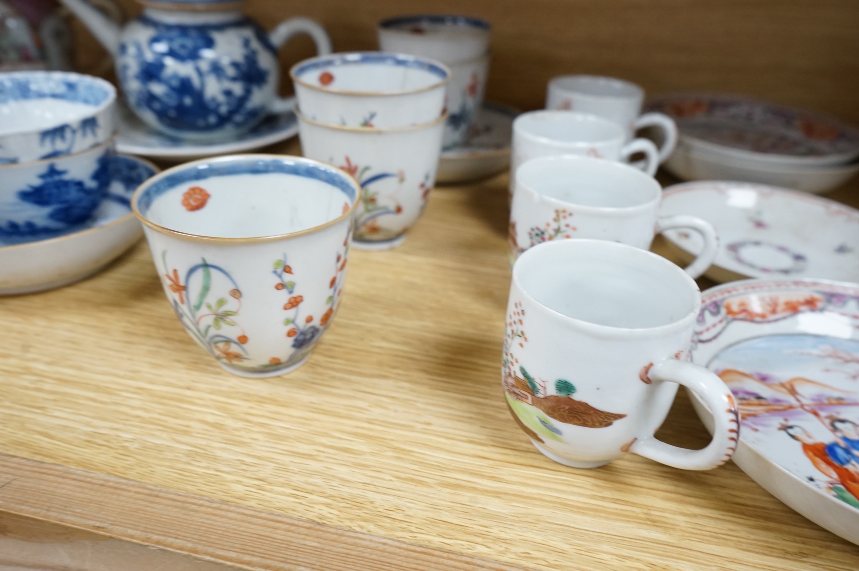 A group of 18th century Chinese export porcelain tea and coffee ware, including Mandarin pattern teapot and cover, two coffee cups and saucers, a blue and white teapot and cover various famille rose coffee cups, etc.